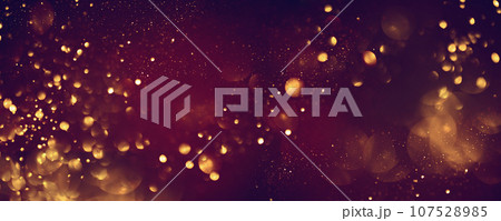 Golden abstract bokeh on black background. 107528985