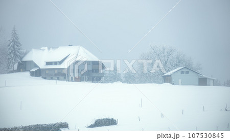 winter snow farmhouse in the Black Forest area south Germany 107530845