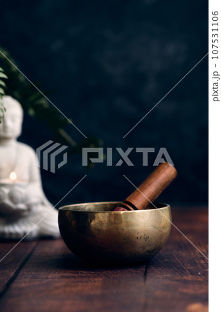 Tibetan bowl on a dark background Tibetan bowl on a dark background 107531106