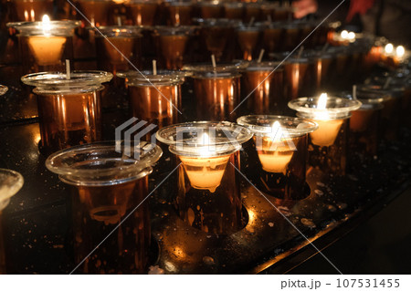 some candles in the church 107531455