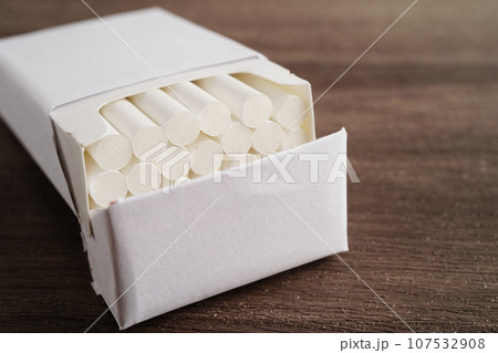 Cigarette in pack, roll tobacco in paper with filter tube, No smoking concept. 107532908
