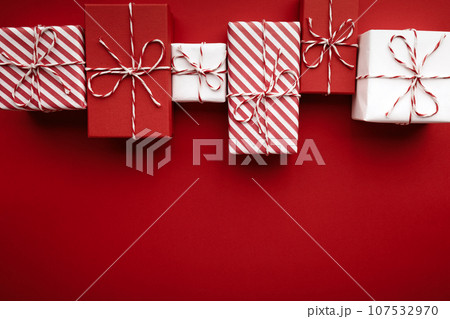 Gift boxes on color background, flat lay, space for text 107532970