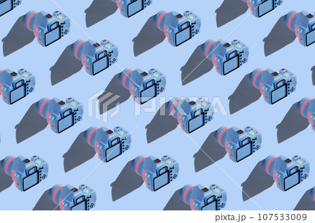 Pattern with SLR camera on pastel color background 107533009