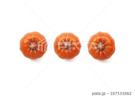 Three orange pumpkins on pastel color background 107533062