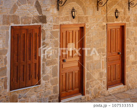 Cute details of windows, doors, balconies from old house in Simi island . Greece islands holidays from Rhodos in Aegean Sea. Colorful neoclassical houses in bay of Symi. Holiday travel background. 107533353