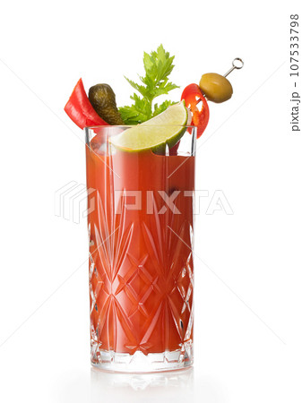 Bloody mary hot mix cocktail with lime slice and celery on white with olive and pickle. 107533798