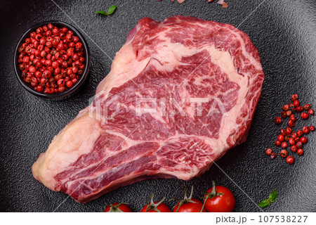Fresh juicy raw beef striploin steak with salt and spices 107538227