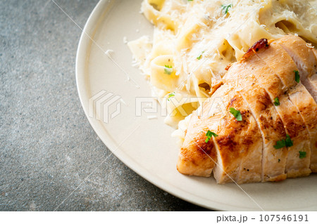 fettucine pasta white creamy sauce with grilled chicken fettucine pasta white creamy sauce with grilled chicken 107546191