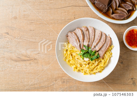 dried duck noodles in white bowl 107546303