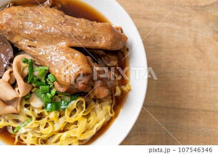 egg noodles with stewed and braised duck in brown soup egg noodles with stewed and braised duck in brown soup 107546346