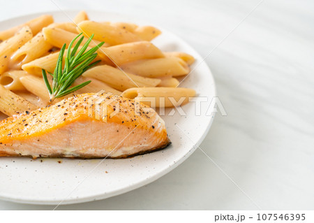 salmon with penne pasta cream sauce salmon with penne pasta cream sauce 107546395