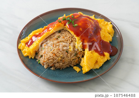 Flavored Fried Rice in an Omelet Wrapping Flavored Fried Rice in an Omelet Wrapping 107546488