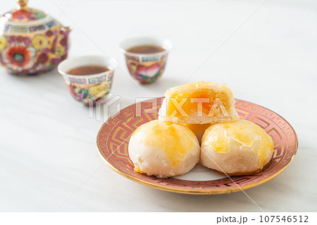 Chinese pastry moon cake with salted egg peanut or Spring Roll pastry with nuts and salted eggs 107546512