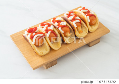 flat pancake roll with sausage 107546692