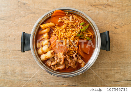 Budae Jjigae or Budaejjigae (Army stew or Army base stew). It is loaded with Kimchi, spam, sausages, ramen noodles and much more Budae Jjigae or Budaejjigae (Army stew or Army base stew). It is loaded with Kimchi, spam, sausages, ramen noodles and much more 107546752