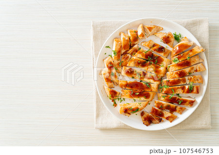 grilled chicken breast sliced on plate grilled chicken breast sliced on plate 107546753