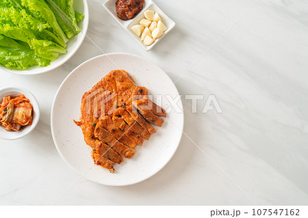 grilled pork marinated Kochujang sauce in Korean style with vegetable and kimchi 107547162