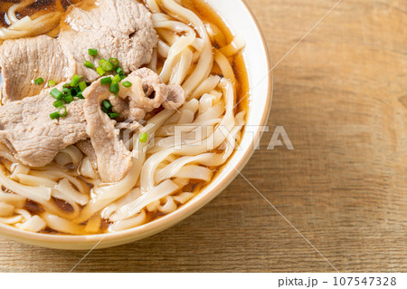 homemade udon noodles with pork in soy or shoyu soup 107547328