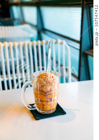 Thai tea ice scoop in glass Thai tea ice scoop in glass 107547412