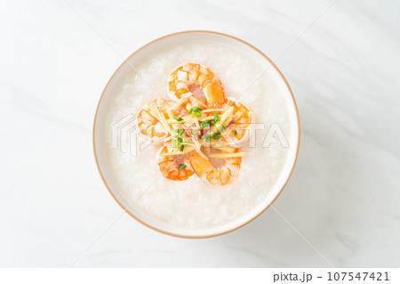 Congee with shrimps and fresh ginger 107547421