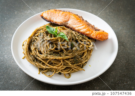 pesto spaghetti pasta with grilled salmon pesto spaghetti pasta with grilled salmon 107547436