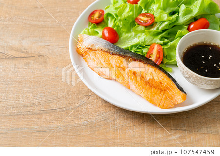 grilled salmon fillet steak with salad grilled salmon fillet steak with salad 107547459