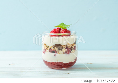 fresh raspberry and yogurt with granola fresh raspberry and yogurt with granola 107547472