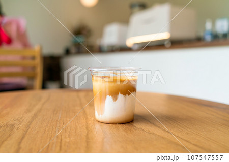 Dirty Coffee - A glass of espresso shot mixed with cold fresh milk Dirty Coffee - A glass of espresso shot mixed with cold fresh milk 107547557