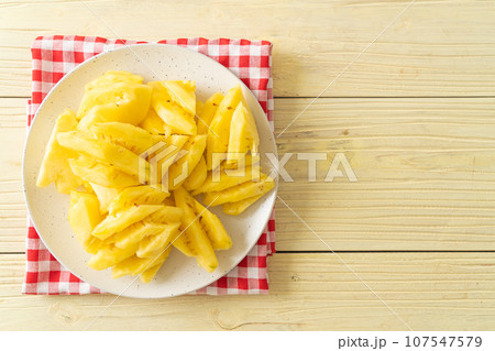 fresh pineapple sliced on plate fresh pineapple sliced on plate 107547579