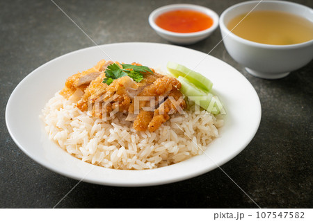 Steamed Rice with Fried Chicken or Hainanese Chicken Rice 107547582