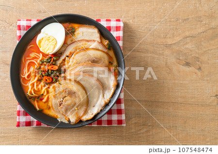 Ramen Noodles Spicy Tomyum Soup with Roast Pork 107548474