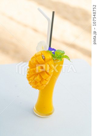 mango smoothies with sea beach background mango smoothies with sea beach background 107548752