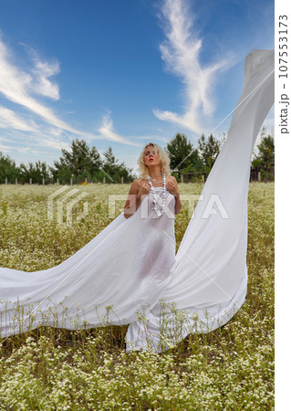 Young beautiful sexy woman in the summer morning field. 107553173