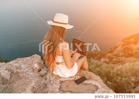 Freelance women sea working on the computer. Good looking middle Freelance women sea working on the computer. Good looking middle 107553995