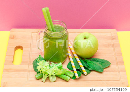 Fresh Green Smoothie of Apple, Celery, and Spinach in Glass Smoothie Jar Fresh Green Smoothie of Apple, Celery, and Spinach in Glass Smoothie Jar 107554199