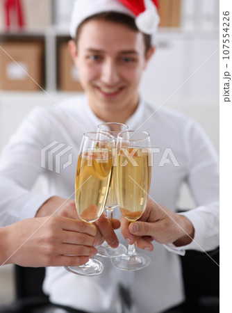 A group of businesspeople celebrating Christmas A group of businesspeople celebrating Christmas 107554226