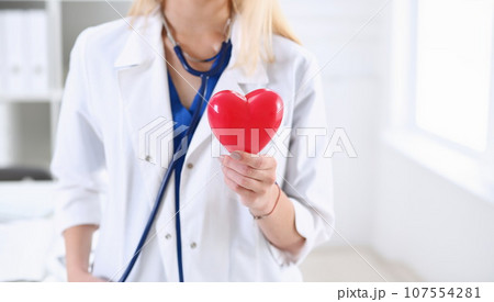 Female medicine doctor hands holding and covering 107554281