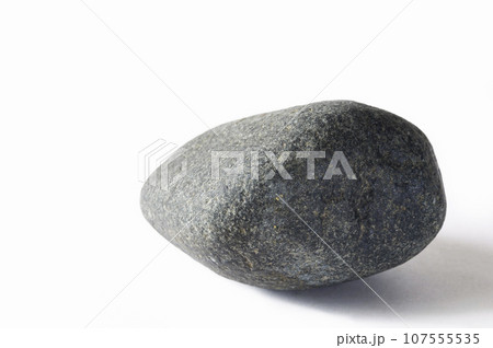 Dark gray stone on a white background. Dark gray stone on a white background. 107555535
