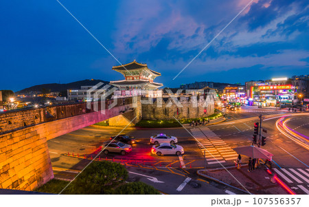 Hwaseong Fortress's Janganmun Gate at dusk. This famous historical site is a UNESCO World Heritage Site, It was almost the former capital of Korea. 107556357