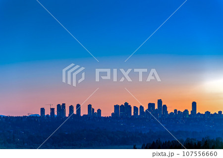 Metrotown district on sunset sky background 107556660