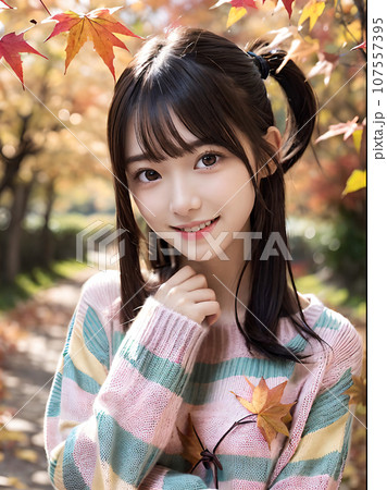 AI画像　秋の紅葉と笑顔の若い女性 107557395