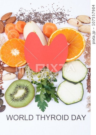 Nutritious ingredients and inscription World Thyroid Day. Healthy food containing vitamins Nutritious ingredients and inscription World Thyroid Day. Healthy food containing vitamins 107557984