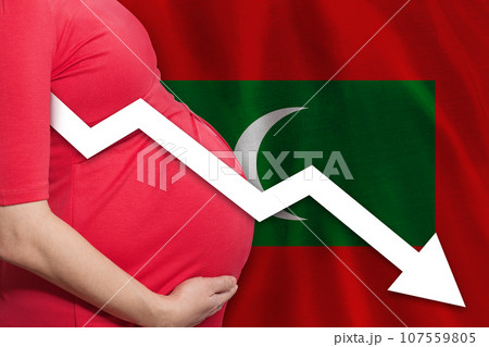 Pregnant woman on flag of Maldives islands background. Falling fertility rate Pregnant woman on flag of Maldives islands background. Falling fertility rate 107559805