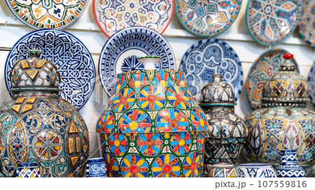 Moroccan pottery with colorful ceramics and pottery displayed outside shops in the souks, or traditional markets. 107559816