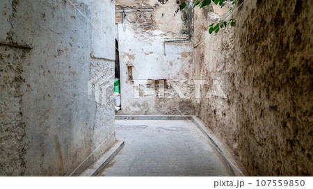 Old, worn out narrow roads of Medina Fes city, that goes around the old town. Old, worn out narrow roads of Medina Fes city, that goes around the old town. 107559850