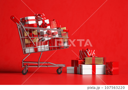Shopping cart with gift box on red background. 107563220