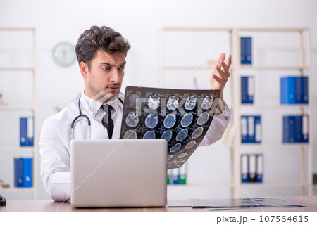 Young male doctor radiologist working in the clinic 107564615