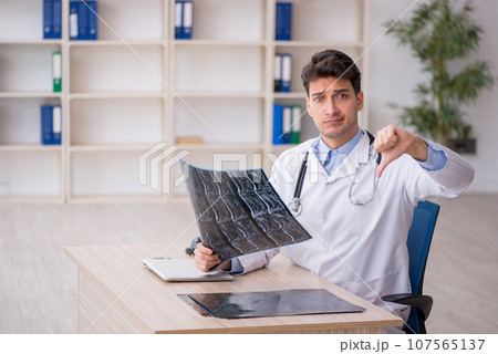 Young male doctor radiologist working in the clinic Young male doctor radiologist working in the clinic 107565137
