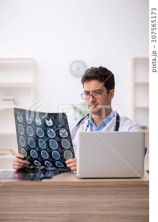 Young male doctor radiologist working in the clinic Young male doctor radiologist working in the clinic 107565173