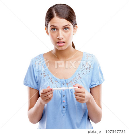 Portrait, pregnant and anxiety by woman and pregnancy test in studio, bad and worry on white background. Pregnancy, stress and girl confused, shocked and surprise by positive testing kit and isolated Portrait, pregnant and anxiety by woman and pregnancy test in studio, bad and worry on white background. Pregnancy, stress and girl confused, shocked and surprise by positive testing kit and isolated 107567723